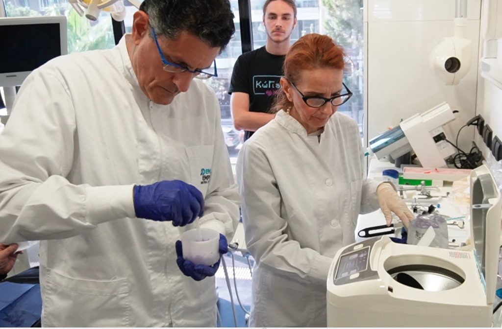 Dentist checking the result of impressions